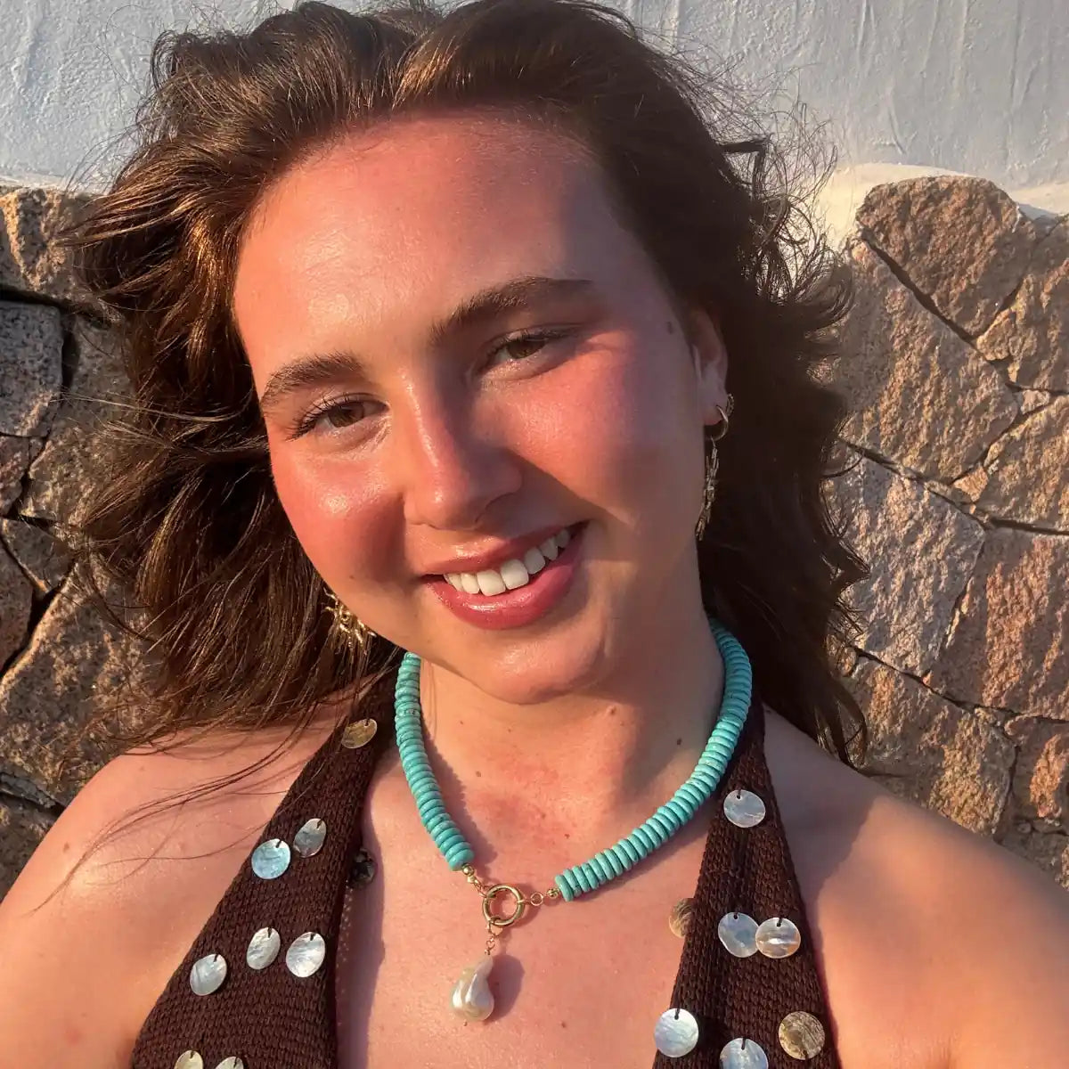 Wulfi necklace worn close in warm daylight
